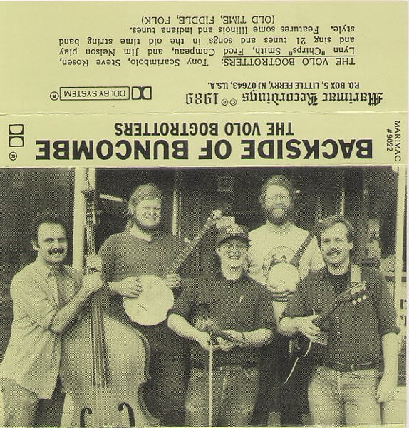 Scan of a black and white tape sleeve printed on paper that is either yellow or yellowed with age. The name of the tape is BACKSIDE OF BUNCOMBE by THE VOLO BOGTROTTERS and features of picture of five men looking into the camera holding instruments