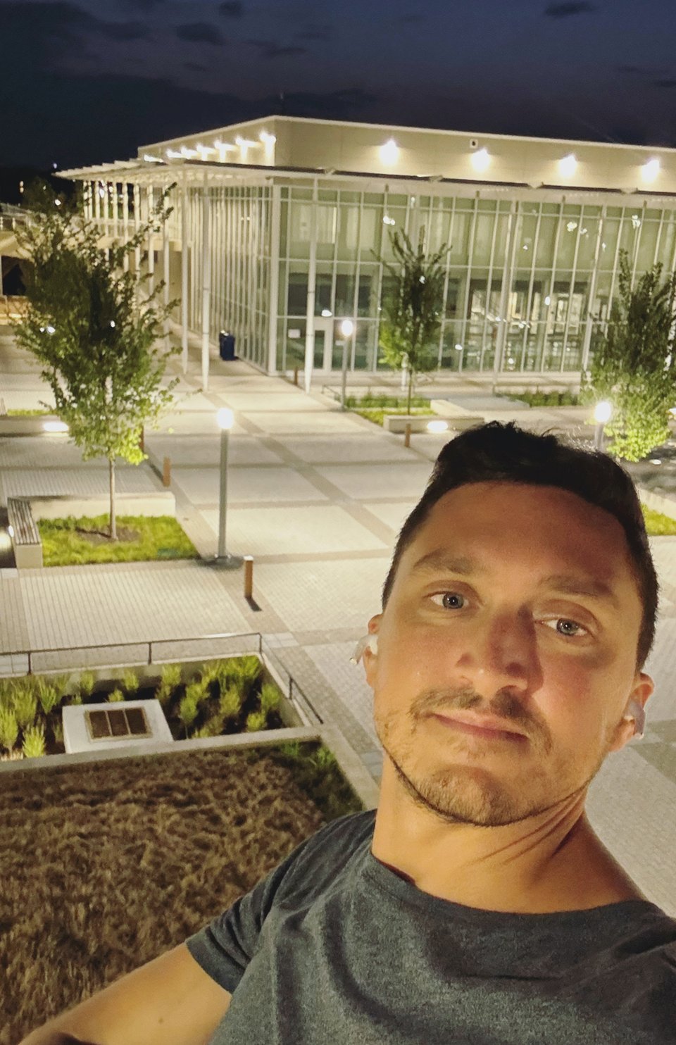 The author in front of a recreation center at night.