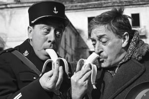 italian actor toto and french actor fernandel untied eating banana