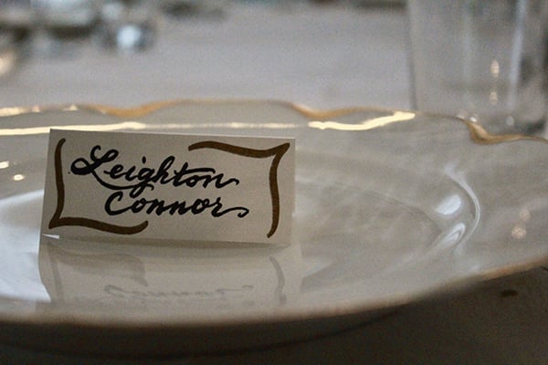 A fancy plate, with a card on it that bears the name Leighton Connor.