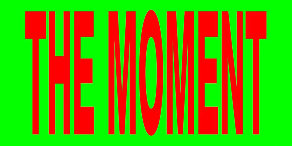 Green and red graphic that simply reads THE MOMENT.