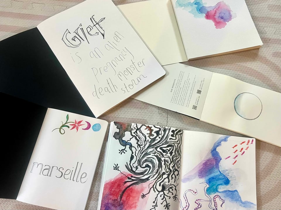six notebooks with pages of them